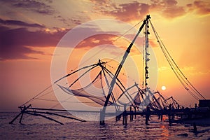 Chinese fishnets on sunset. Kochi, Kerala, India photo