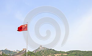 Chinese flag in front of the chinese wall