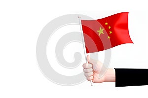Chinese flag in handon white background.China symbol.ai generated