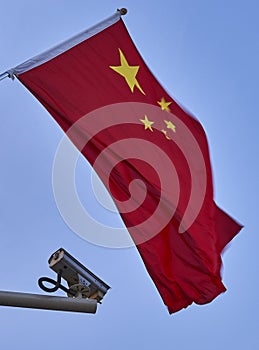 Chinese flag and a surveillance camera