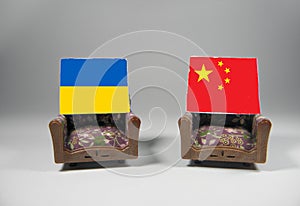 The Chinese flag and the Ukrainian flag are placed on the chairs