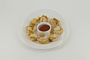 Chinese foo with tomato sauce in a white plate