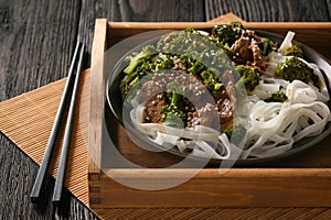 Chinese food - beef prepared with broccoli and rice noodles.
