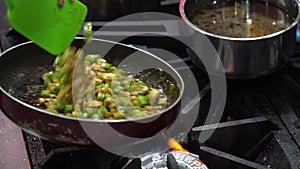 The Chinese food cooking process,stir the vegetable and ingredient in the pan