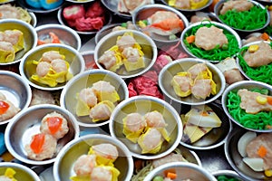 Chinese food dim sum on self service busket tray background.