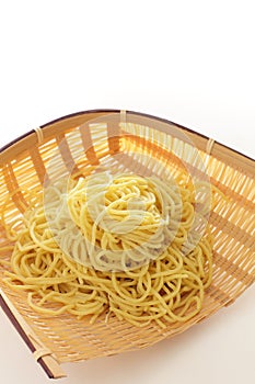 Chinese food, egg noodles in bamboo basket for prepared food ingreddient