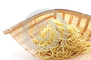 Chinese food, egg noodles in bamboo basket for prepared food ingreddient