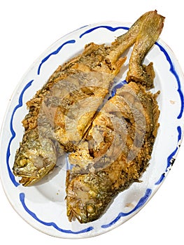Chinese food - grilled whole fishes on plate