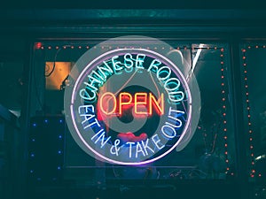 Chinese food neon sign at night, in The Bronxs Little Italy, New York City