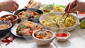 Chinese food set. Chinese noodles, fried rice with chicken, shrimps, spring rolls, deep fried crispy chicken