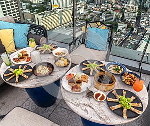 chinese food on the table in rooftop restaurant