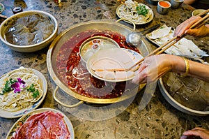 Chinese foods Double flavor hot pot on the table