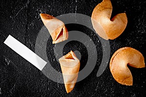 Chinese fortune cookie with prediction on dark background top vi