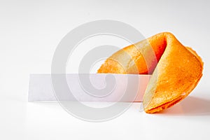 Chinese fortune cookie with prediction on white background