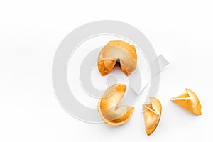 Chinese fortune cookie with prediction on white background top view space for text