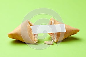 Chinese fortune cookies. Cookies with empty blank inside for prediction words. Green background.