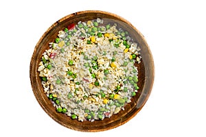 Chinese Fried rice with egg and vegetables in a wooden plate. Isolated on white background.