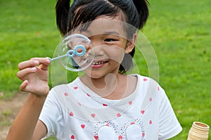 Chinese girl blow bubbles