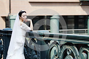 Chinese Girl bride in wedding dress with a beautiful imperial crown