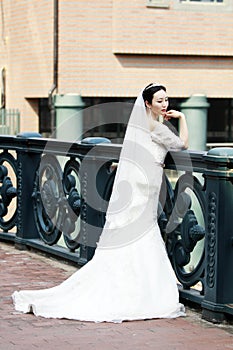 Chinese Girl bride in wedding dress with a beautiful imperial crown