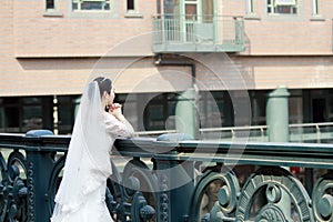 Chinese Girl bride in wedding dress with a beautiful imperial crown pray