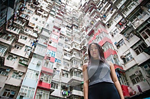 Traveler Exploring Densely Populated Housing Apartments in Hong Kong photo