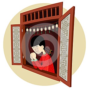 Chinese girl praying in the window