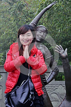 Chinese girl and sculpture