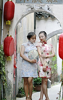 Chinese girlfriends in cheongsam enjoy free time