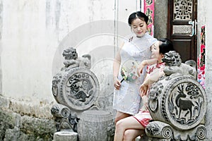 Chinese girlfriends in cheongsam enjoy free time
