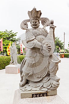 Chinese god statue, as musician