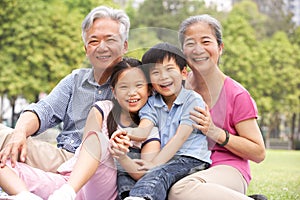 Chinese Grandparents Sitting With Grandchildren