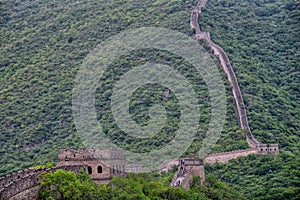 The Chinese Great Wall near Beijing hidden in the thick forest