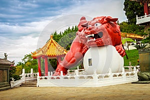 A Chinese Guardian Lion with the ball can be seen at the main en