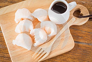 Chinese har gao dim sum dumplings on wooden plate