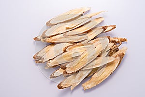 Chinese herbal medicines -- Astragalus on white background, blank for text
