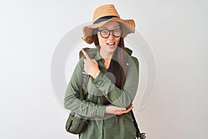 Chinese hiker woman wearing canteen hat glasses backpack over isolated white background with a big smile on face, pointing with