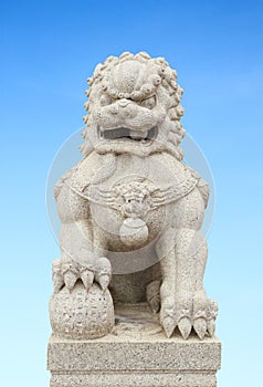 Chinese Imperial Lion Statue with sky