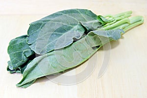 Chinese Kale or Chinese Broccoli vegetable on wood back