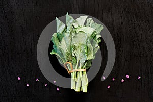 Chinese kale vegetable on the back wood background