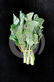 Chinese kale vegetable on the back wood background