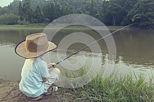 Chinese kid with fishing rod 