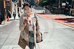 Chinese lady holding smartphone texting message