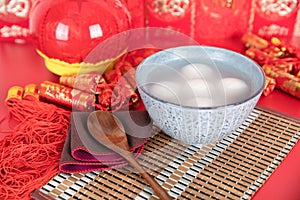 Chinese Lantern Festival food Yuanxiao or Tangyuan on red background