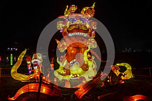 Chinese Lantern Festival in honor of the New Year. Sculpture depicting a huge fire dragon with street lighting