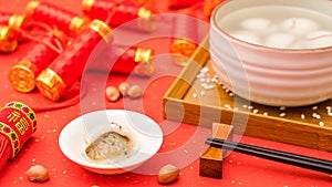 Chinese Lantern Festival traditional cuisine peanut dumplings on red background