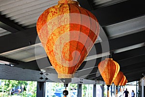 Chinese lantern lights hanged on a building roof