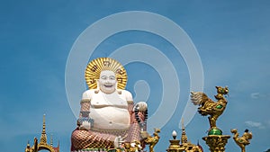 Chinese Laughing Buddha at Plai Laem Temple - Main Symbol and Popular Landmark of Samui Island in Thailand. Tourism and