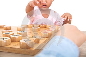 Chinese little girl is playing Chinese chess seriously