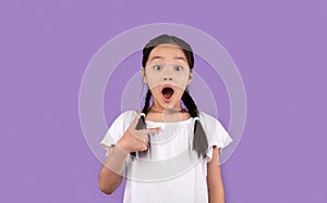 Chinese Little Girl Pointing At Herself Posing Over Purple Background